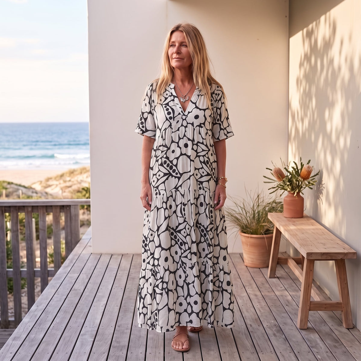 Christine | Lightweight and Fluid Summer Dress – Black worn on an Australian coastal verandah