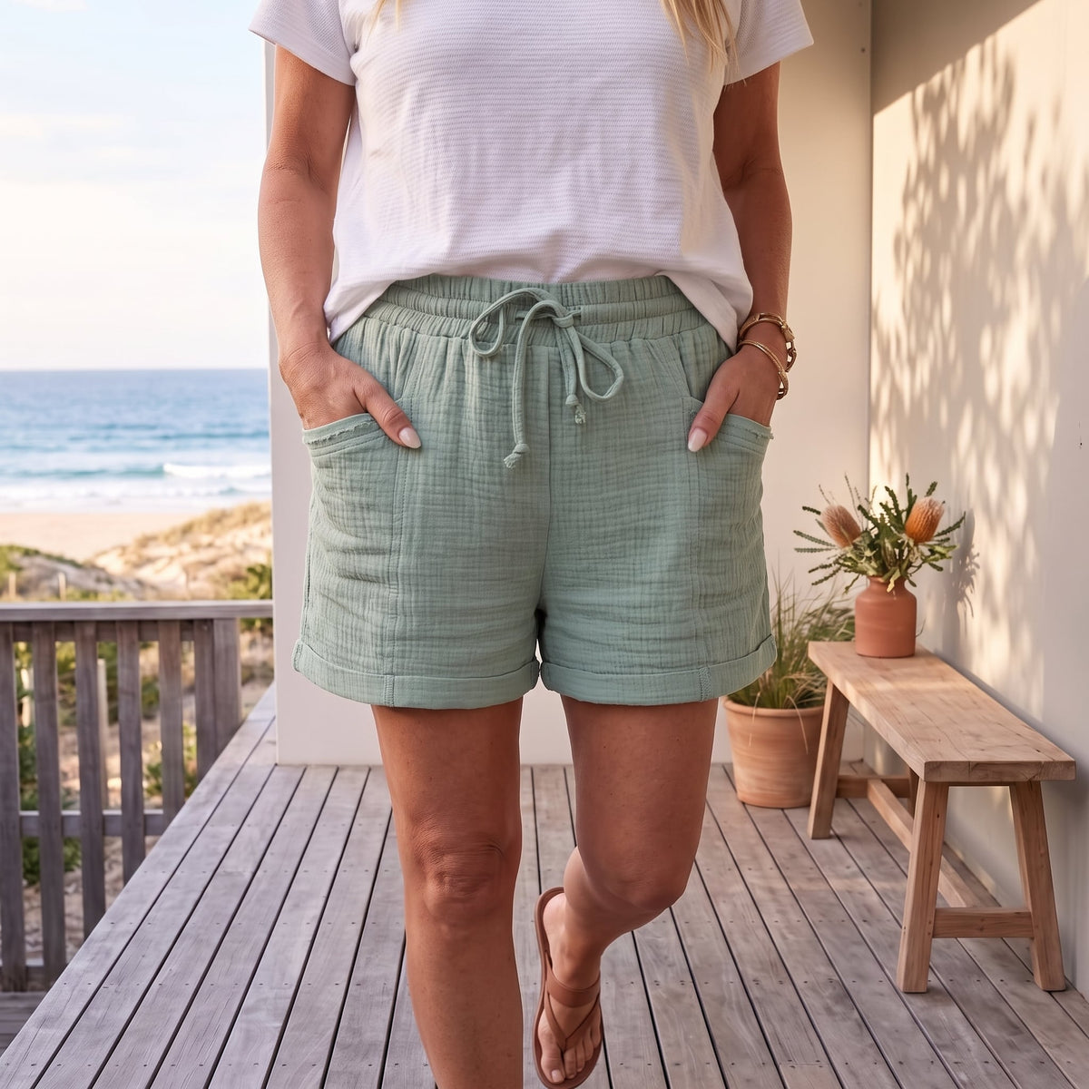 Susan™ | Effortlessly Comfortable Summer Shorts – Turquoise worn on an Australian coastal verandah