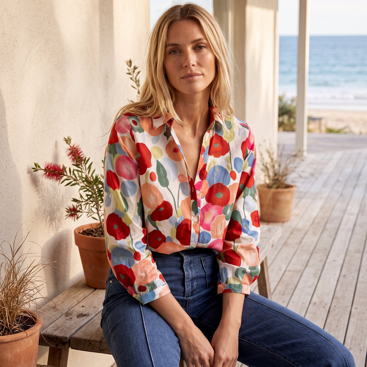 Poppy | Women's Floral Print Long Sleeve Button-Up Shirt – Multicolour worn on an Australian coastal verandah