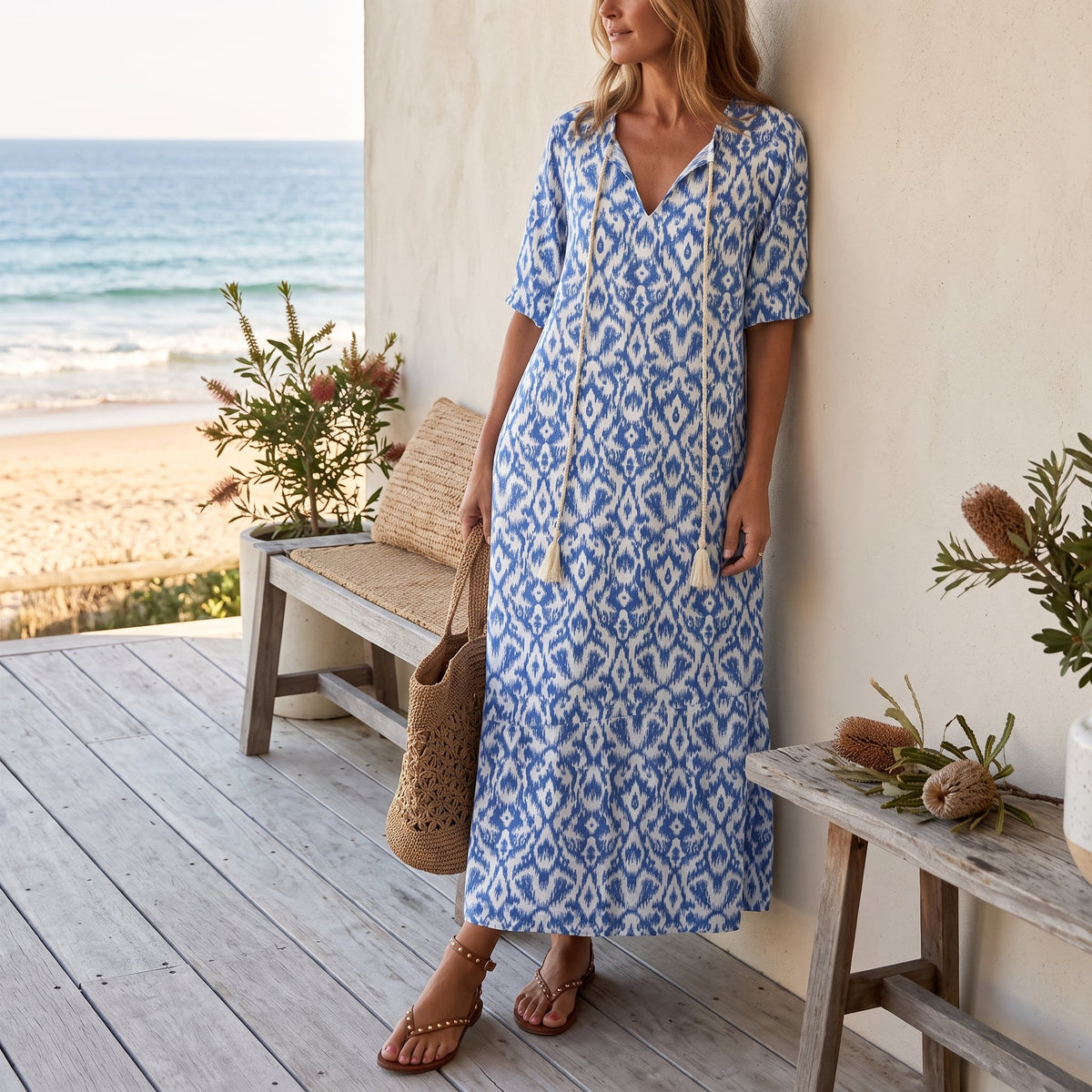 Andrea | Boho Vintage V-Neck Printed Dress – Blue worn on an Australian coastal verandah