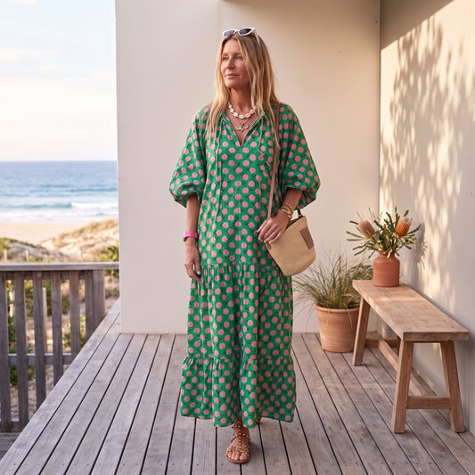Cassandra | Women's Geometric Print High-Low Dress – Green & Pink worn on an Australian coastal verandah