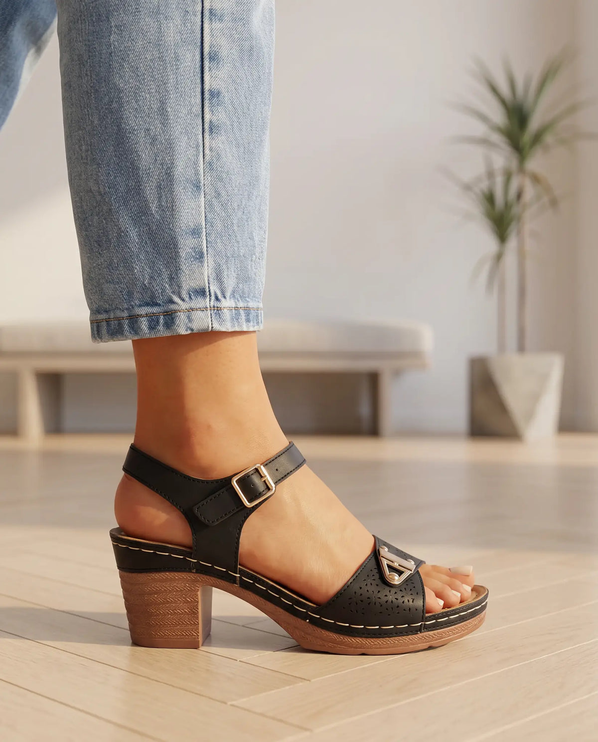 Casuarina Amalfi sandal in black, detail view of hardware and strap