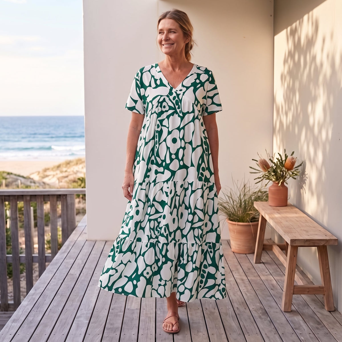 Christine | Lightweight and Fluid Summer Dress – Green worn on an Australian coastal verandah