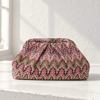 Juno Jacquard Pleated Clutch – front view on a white table