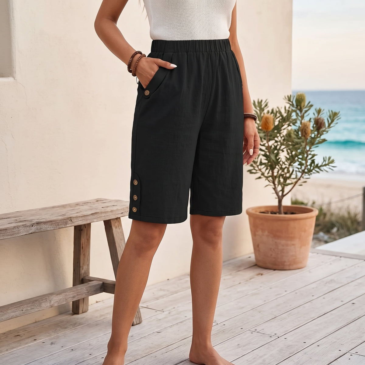 Lolo | Women's Casual Bermuda Shorts with Pockets – Black worn on an Australian coastal verandah