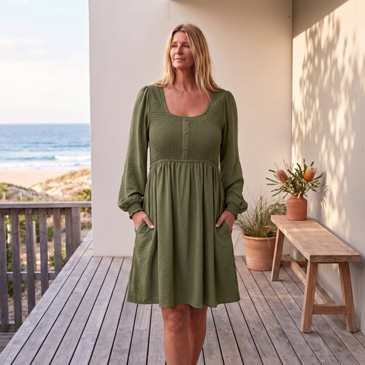 Penny | Women's Smocked Square Neck Puff Sleeve A-Line Mini Dress – Green worn on an Australian coastal verandah
