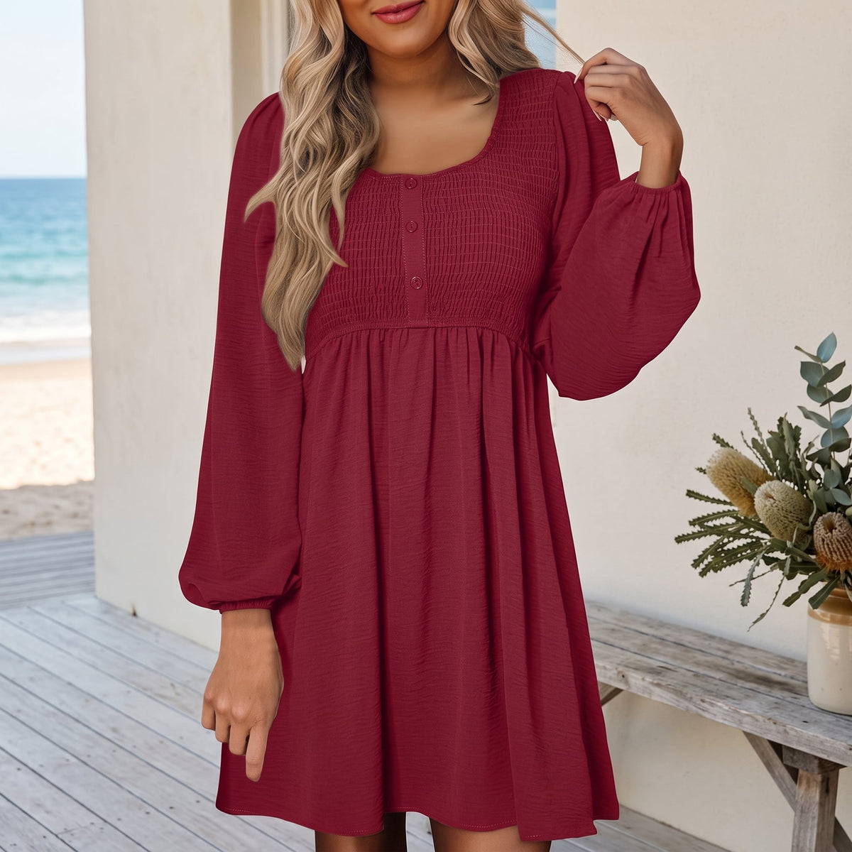 Penny | Women's Smocked Square Neck Puff Sleeve A-Line Mini Dress – Pink worn on an Australian coastal verandah