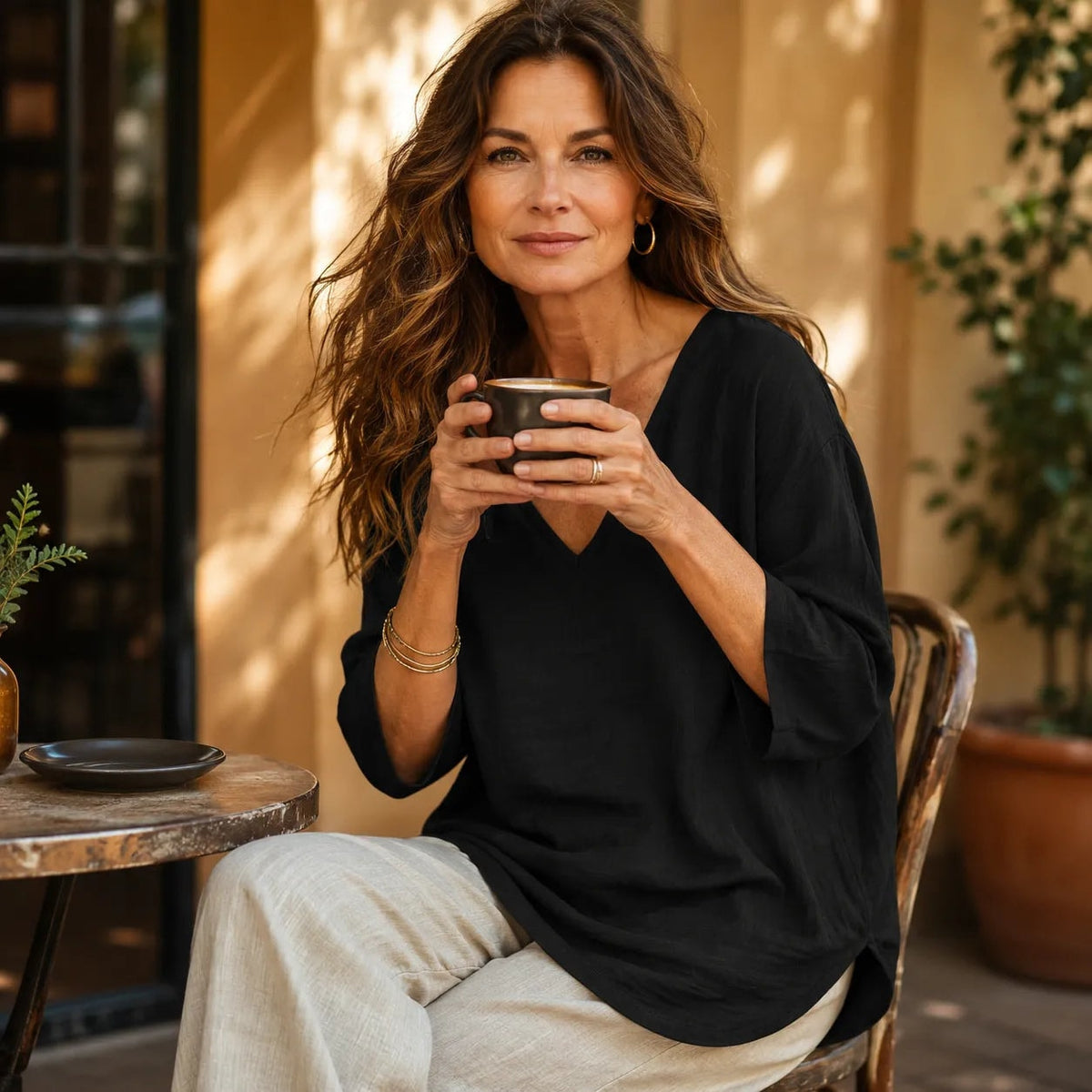 Casuarina Soraya Relaxed V-Neck Top — black, seated view